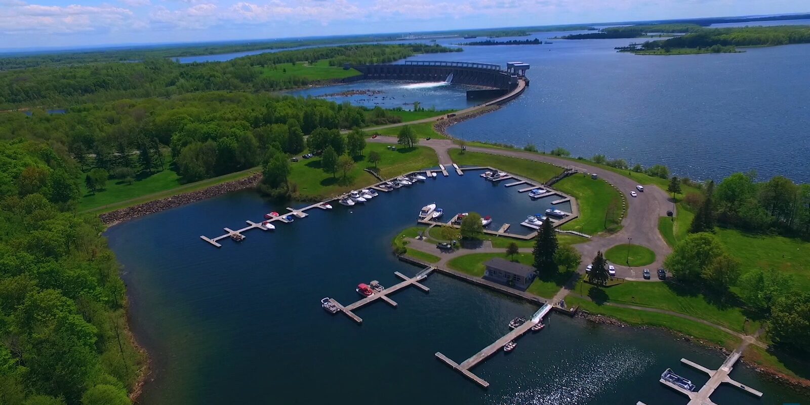 aerial view of river with docks and a dam