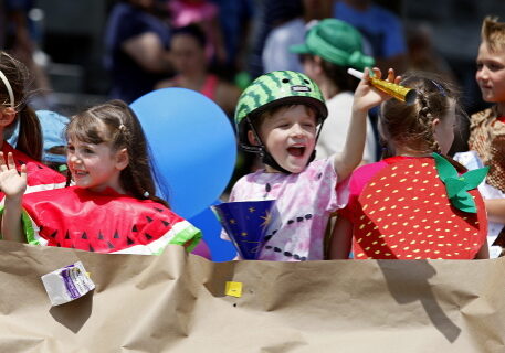 JASON HUNTER n WATERTOWN DAILY TIMES
Olivia Sommerstein, left and Miles Attemann, wave from the Nature's Storehouse float Saturday during the annual Dairy Princess Festival Parade in downtown Canton.