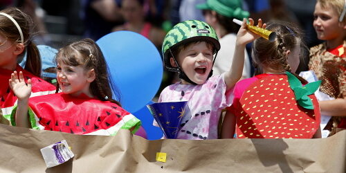 JASON HUNTER n WATERTOWN DAILY TIMES
Olivia Sommerstein, left and Miles Attemann, wave from the Nature's Storehouse float Saturday during the annual Dairy Princess Festival Parade in downtown Canton.